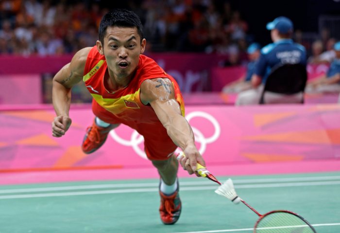 China's Lin Dan dives for a return while playing against Sho Sasaki, of Japan, in a men's singles badminton quarterfinal match at the 2012 Summer Olympics, Thursday, Aug. 2, 2012, in London. (AP Photo/Andres Leighton)